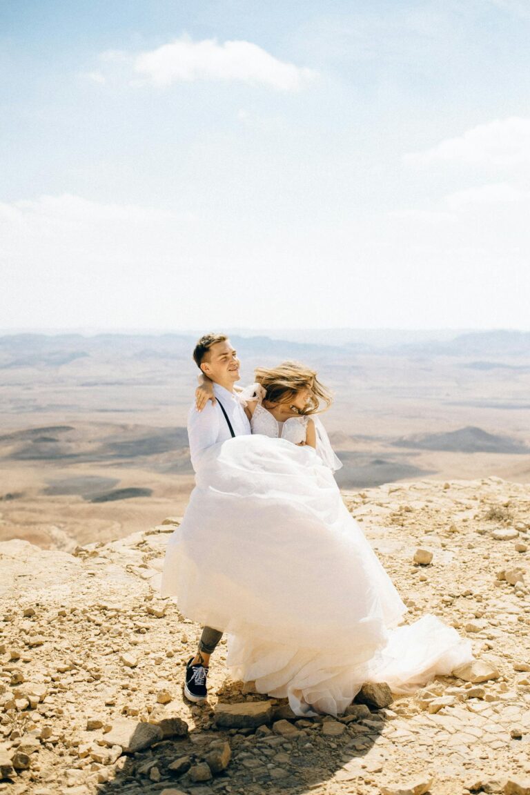 A Groom Carrying Her Bride in the Desert